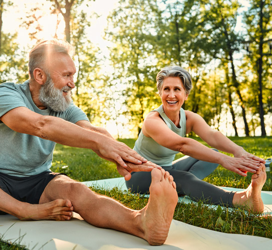 Man-and-woman-performing-stretching-exercises