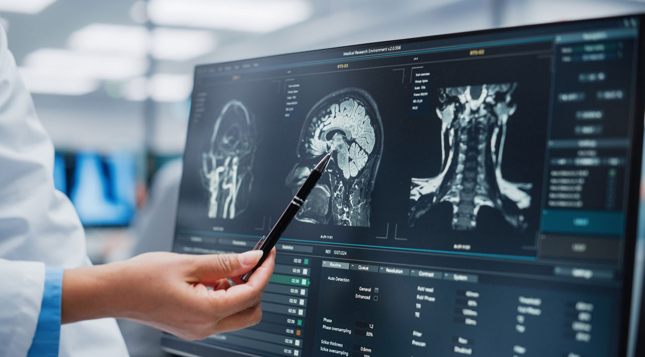 doctor-pointing-to-spine-scans-on-a-screen