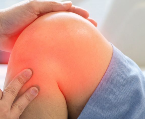 Doctor-checking-up-patient-knee-bone-and-joint